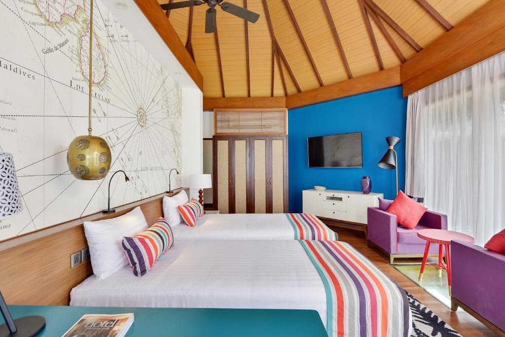 Mercure Maldives Kooddoo Water Villa Bedroom